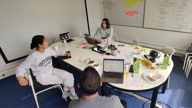 People from the agency sitting by a table